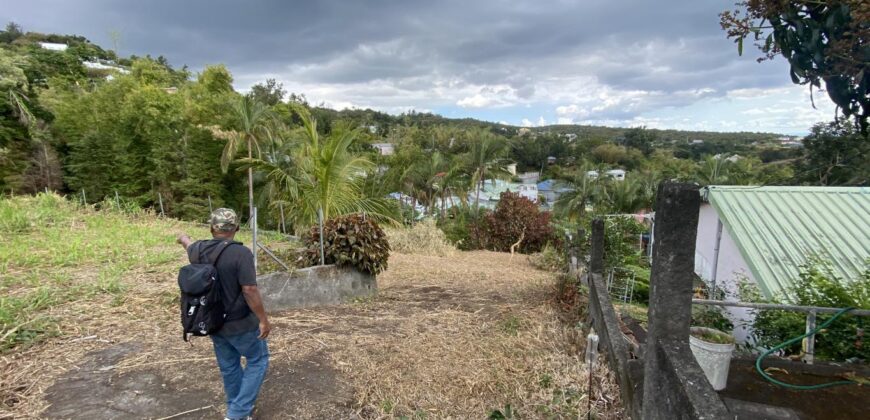 A vendre un beau terrain constructible de 1410m2 offrant vue montagne à La Montagne