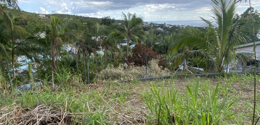A vendre un beau terrain constructible de 1410m2 offrant vue montagne à La Montagne
