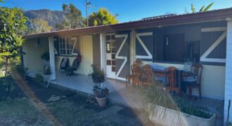 En vente une maison de type bourbon bois sur un terrain de 409m2 au 2ème village de la Plaine des Palmistes