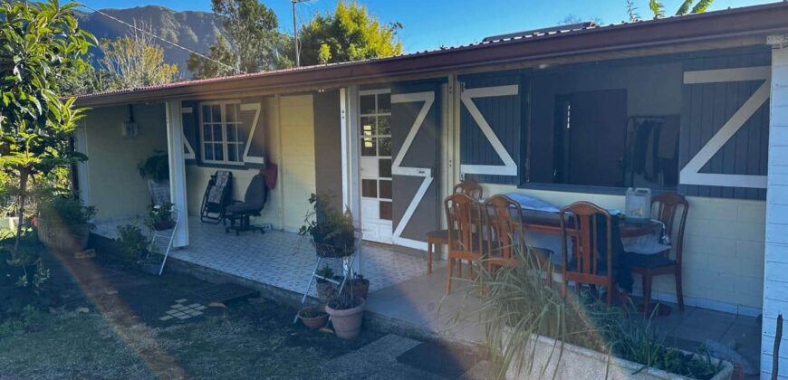 En vente une maison de type bourbon bois sur un terrain de 409m2 au 2ème village de la Plaine des Palmistes