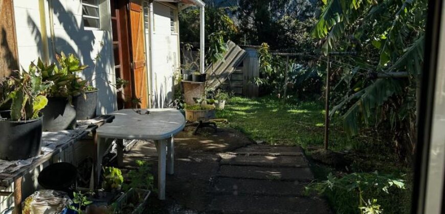 En vente une maison de type bourbon bois sur un terrain de 409m2 au 2ème village de la Plaine des Palmistes