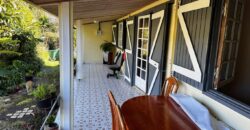 En vente une maison de type bourbon bois sur un terrain de 409m2 au 2ème village de la Plaine des Palmistes