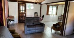 En vente une maison de type bourbon bois sur un terrain de 409m2 au 2ème village de la Plaine des Palmistes