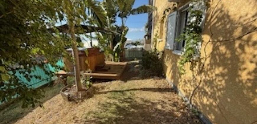 En vente un bel appartement F3/4 en rez-de-jardin d’un immeuble à La Possession